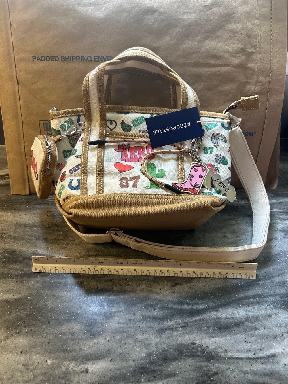 Aeropostale White Canvas Crossbody Satchel with Tan Trim and Multicolor Graphics
